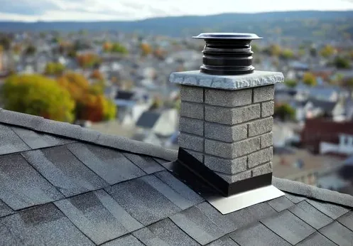 Brick chimney with a new cap on a New Albany home